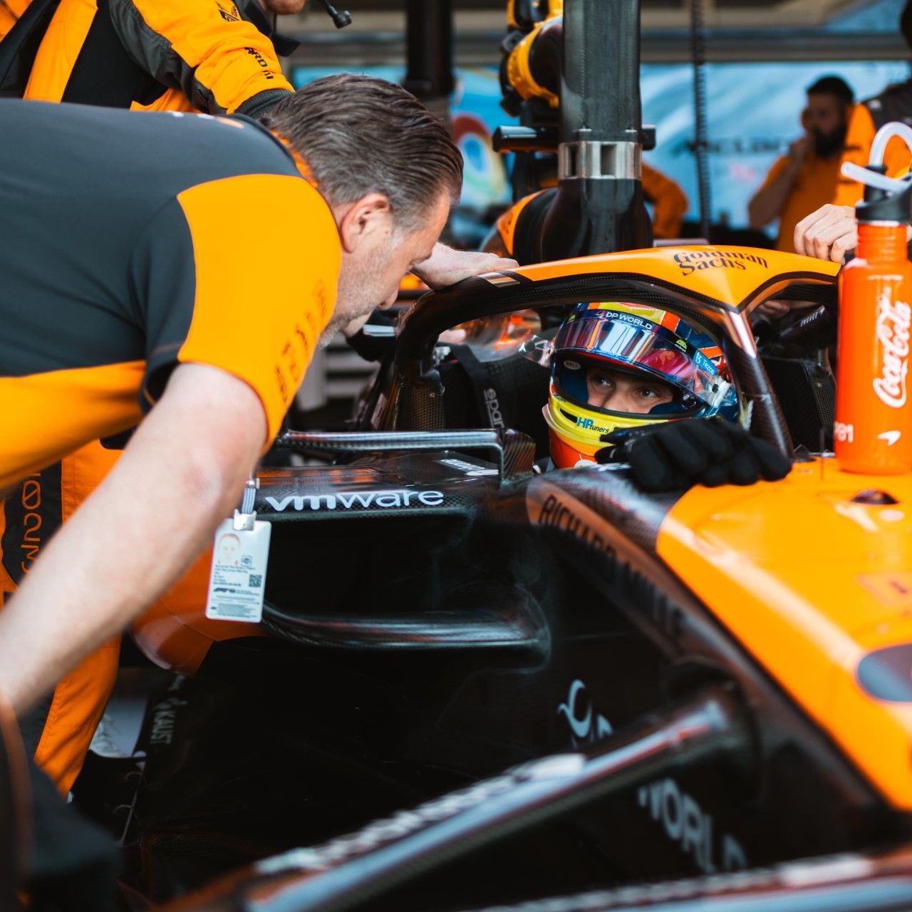 CEO Zak Brown speaking to Oscar in the garage at Silverstone