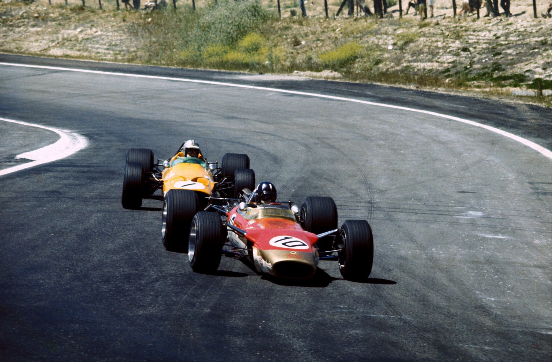 Denny Hulme chases Graham Hill in the 1968 Spanish Grand Prix