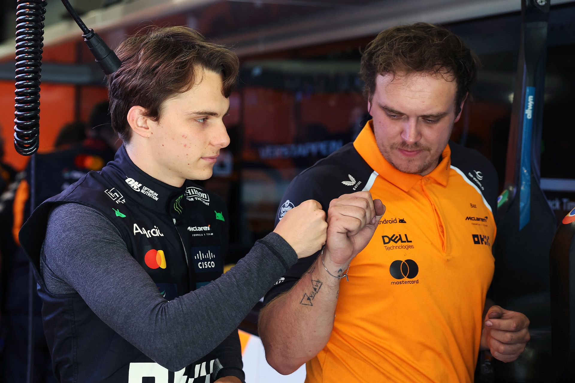 Oscar fist bumps an engineer in Spain