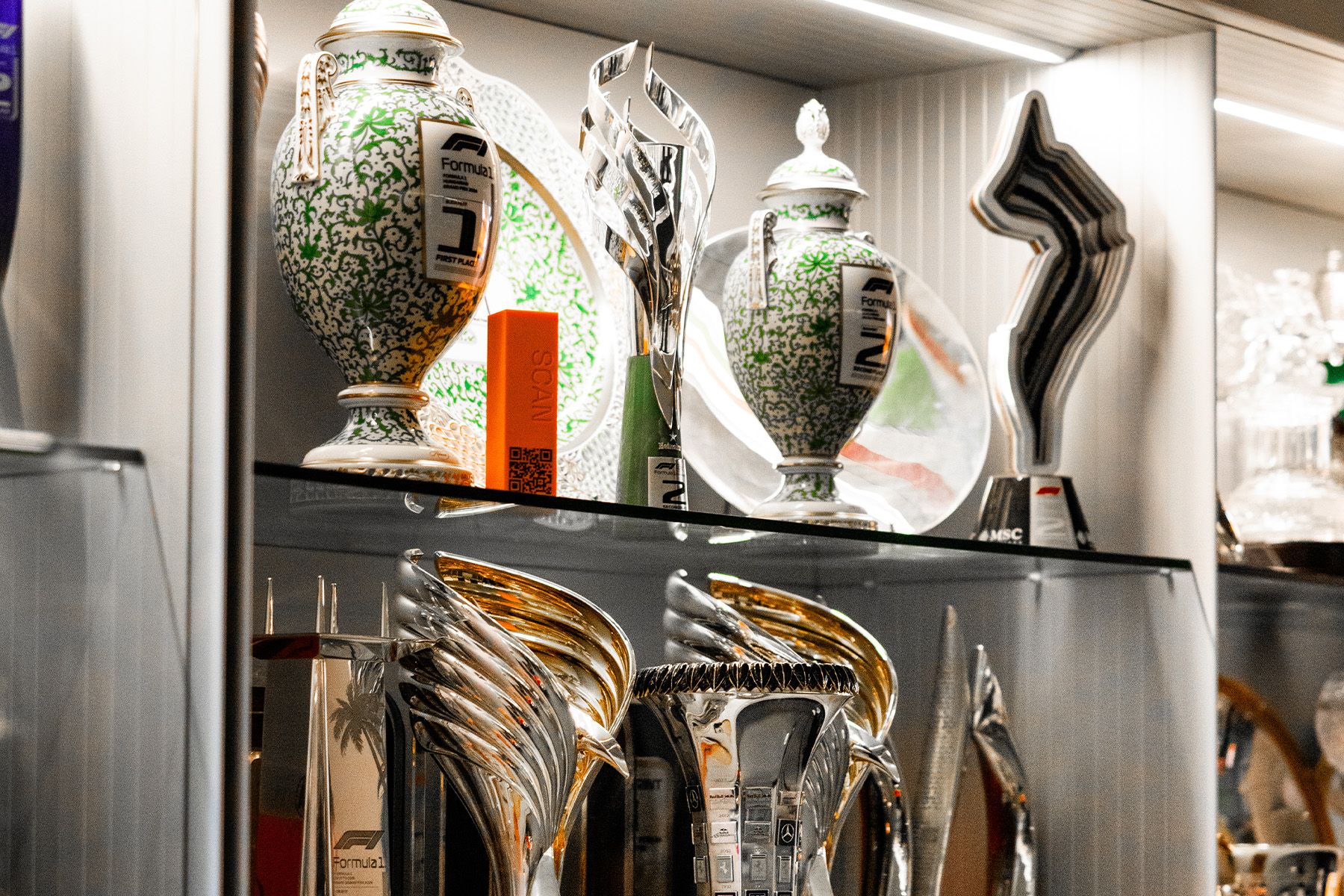 At which rounds did McLaren’s Drivers’ World Champions clinch their titles?