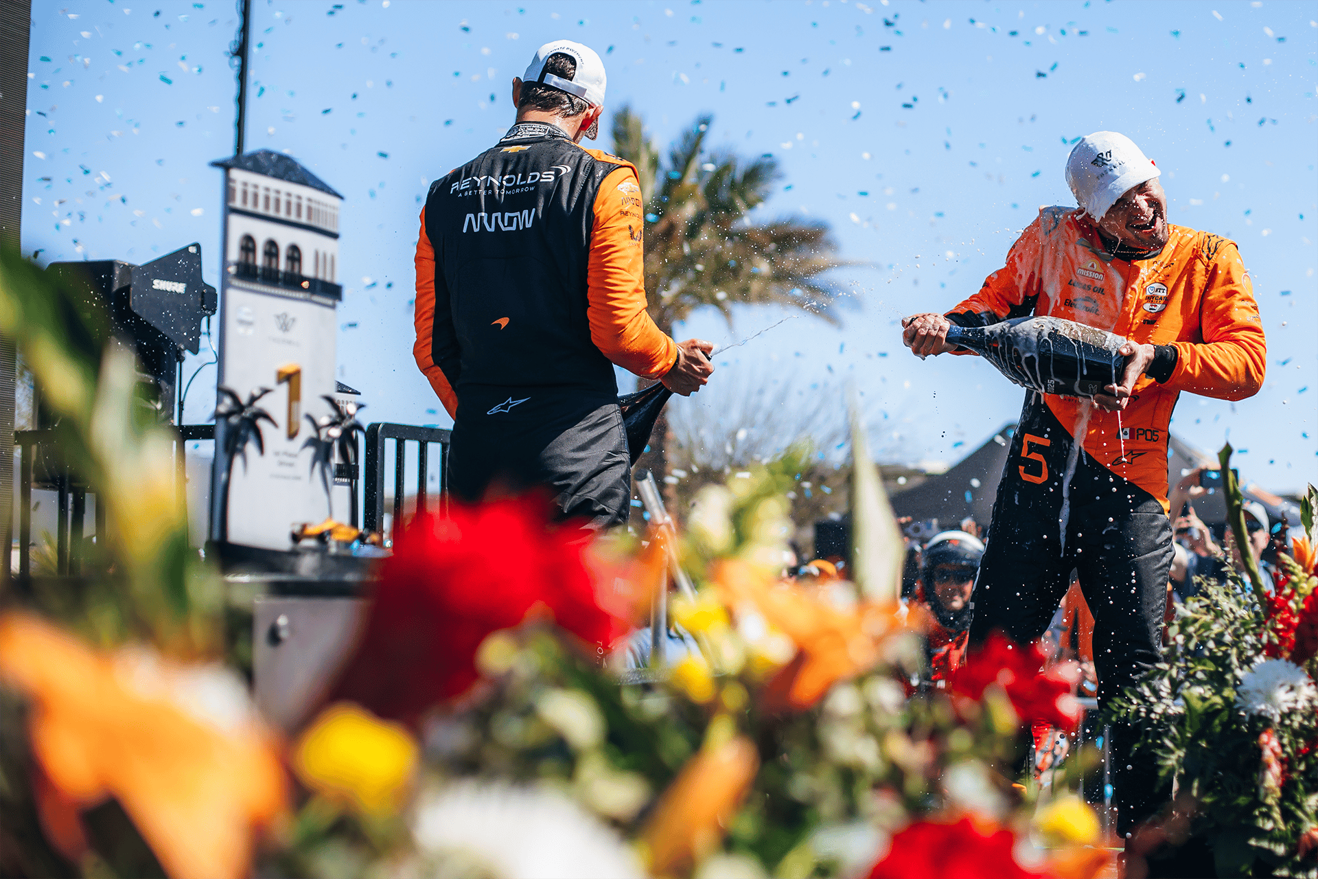 Christian Lundgaard and Pato O'Ward celebrating on the podium at 2025 Thermal