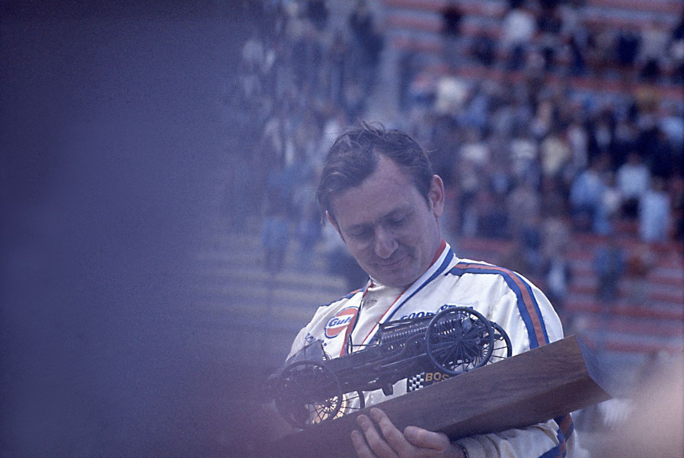 Bruce receives his winner’s trophy after victory in 1969 Michigan International Can-Am