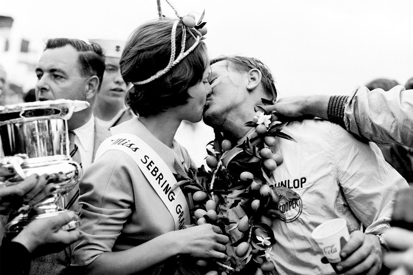 Bruce gets a kiss from Miss Sebring Grand Prix after receiving his winner's garland